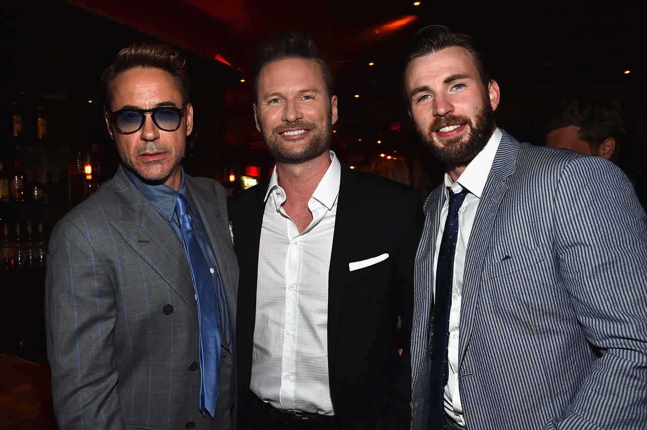 HOLLYWOOD, CA - APRIL 13: (L-R) Actor Robert Downey Jr., composer Brian Tyler and actor Chris Evans attend the after party for Marvel's "Avengers: Age Of Ultron" at Ohm Nightclub on April 13, 2015 in Hollywood, California. (Photo by Alberto E. Rodriguez/Getty Images for Disney) *** Local Caption *** Robert Downey Jr;Chris Evans;Brian Tyler